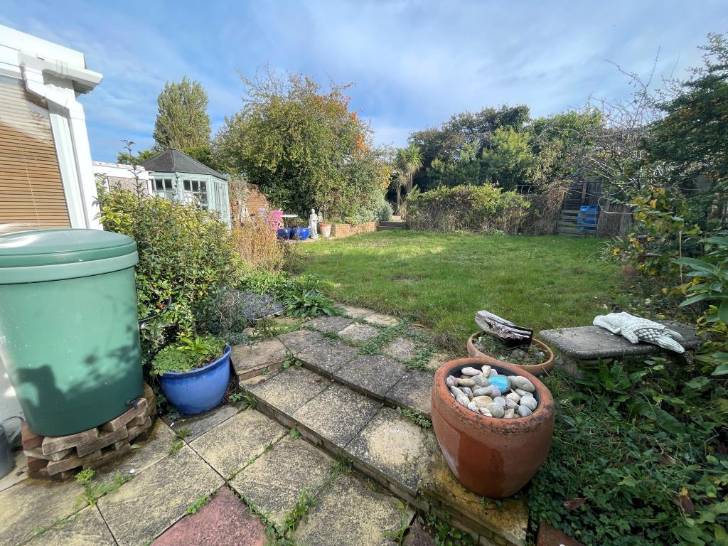 Lot: 88 - FIRE-DAMAGED DETACHED BUNGALOW - Garden with patio and decking